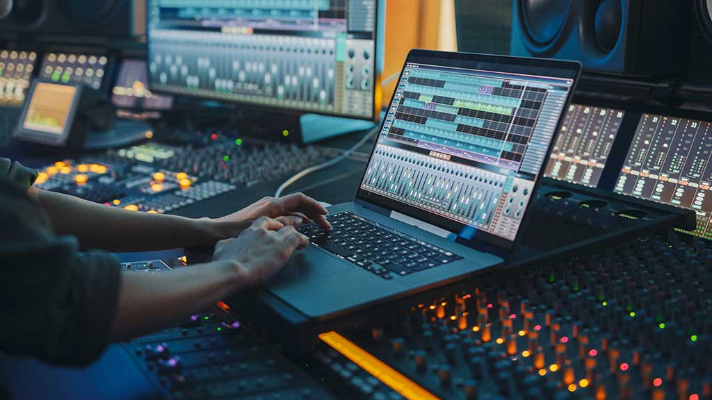 Modern Music Record Studio Control Desk with Laptop